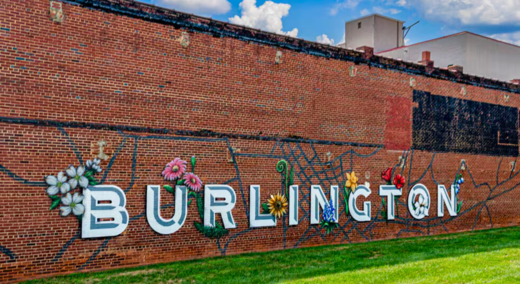 Colorful Burlington mural painted on a downtown brick building.