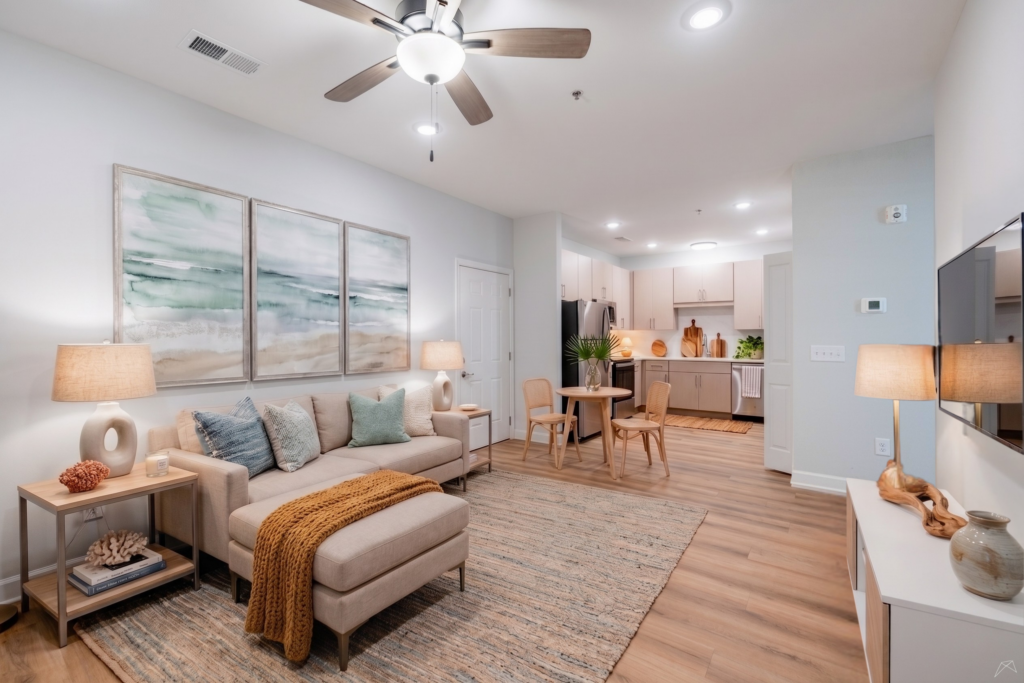 Open-concept living room and kitchen at Preston Park Apartments.