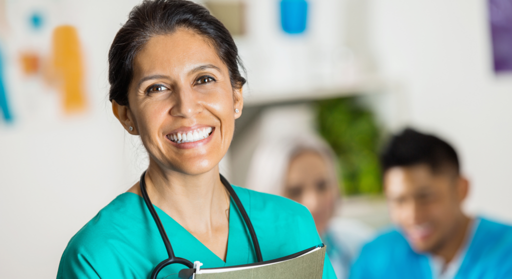 Health care working looking at us and smiling